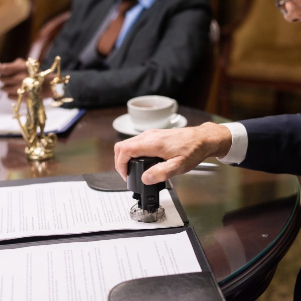 hand-of-director-of-company-putting-stamp-on-document.jpg hand-of-director-of-company-putting-stamp-on-document.jpg